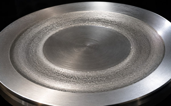 Circular sputtering target showing a concentric erosion track from PVD service