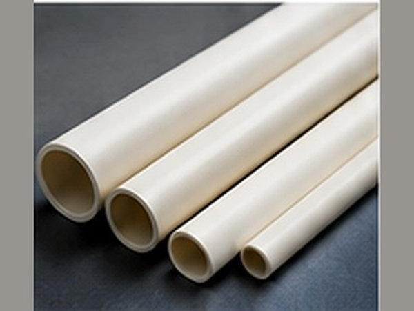 Several smooth white ceramic tubes and rods displayed diagonally.