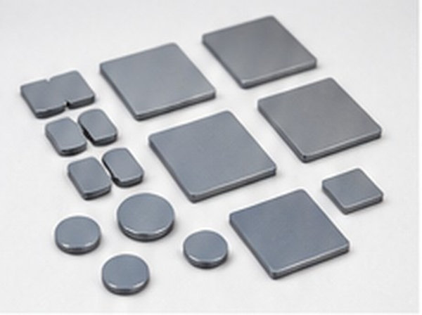 Mixed round and rectangular silicon components arranged on a clean light surface.