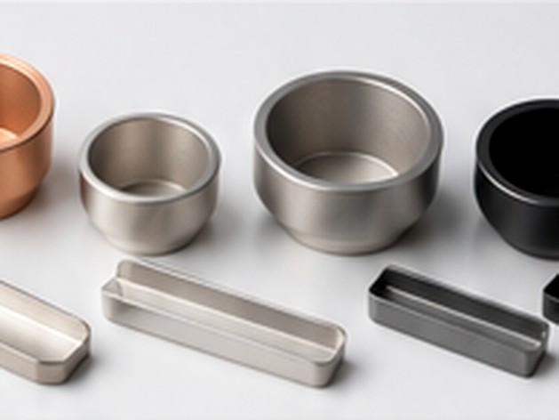 Metallic and ceramic source containers arranged for thermal and electron-beam evaporation processes.