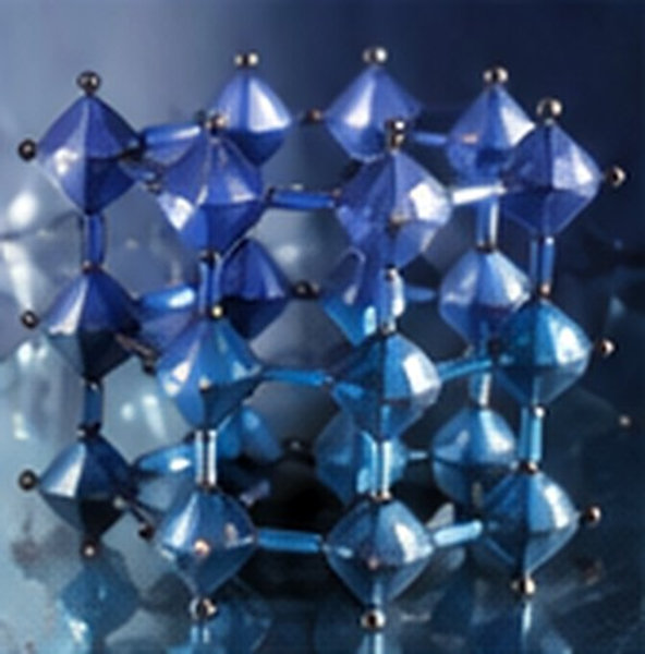 A blue three-dimensional crystal framework represents a metal halide perovskite structure.